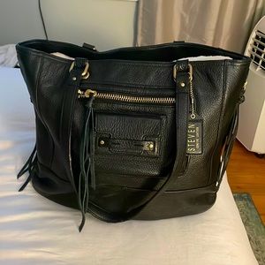 STEVEN by Steve Madden Black Leather Handbag with Gold Details and Tassles